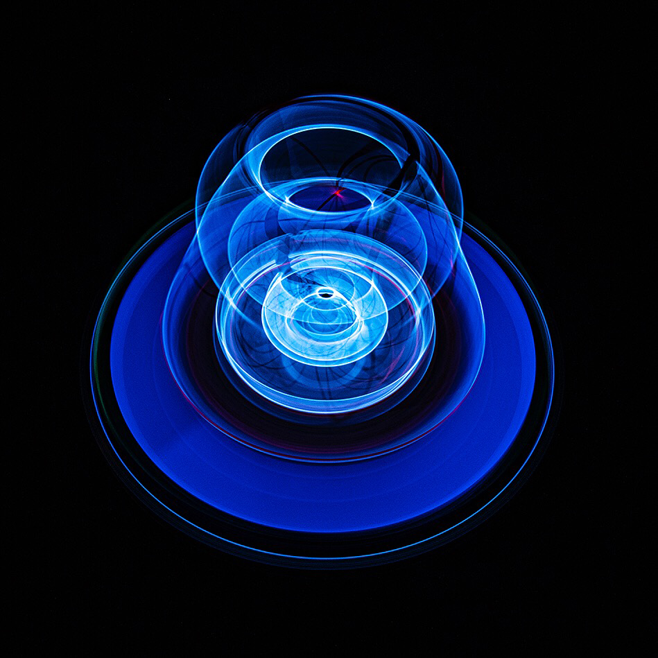 Blue light forming a layered, bulb-like shape